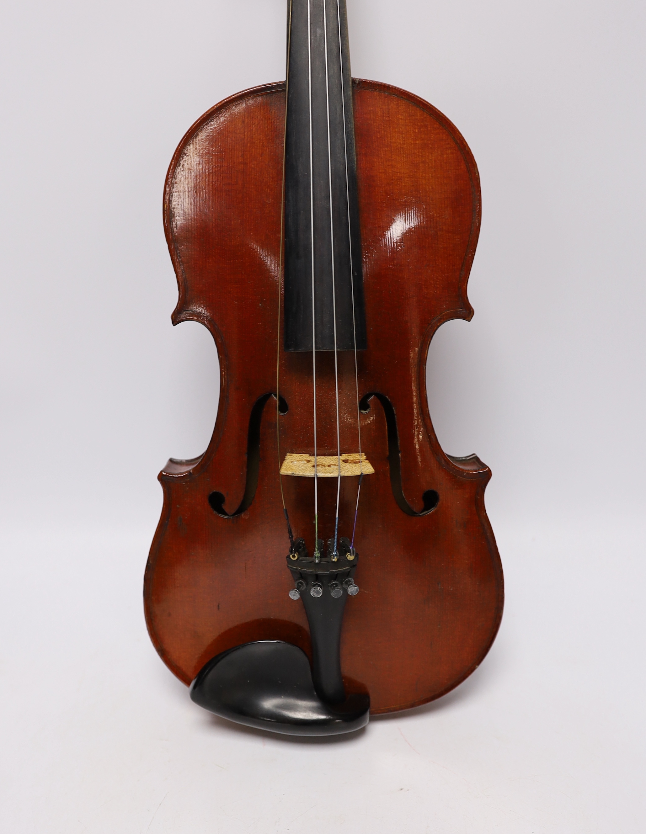 A wooden cased student violin